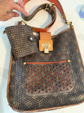 The LV Monogram Perforated Musette in Orange & wallet set